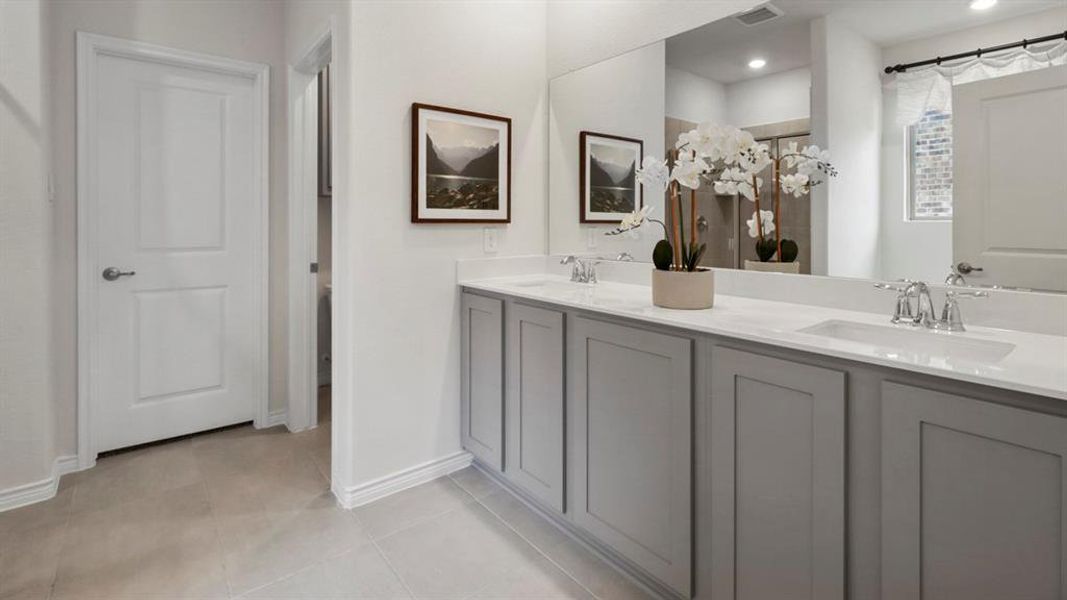 Full bath featuring double vanity, light tile patterned flooring, a shower with shower curtain, and recessed lighting