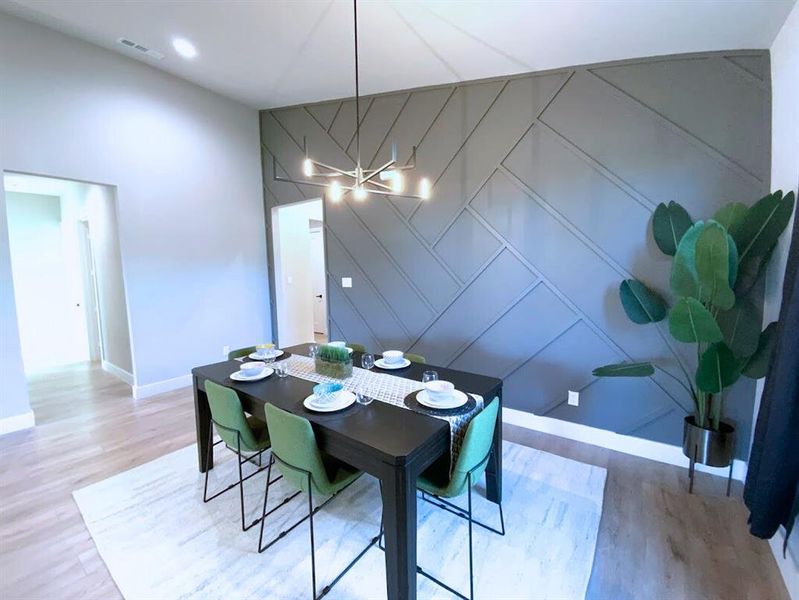Dining area with decorative accent wall