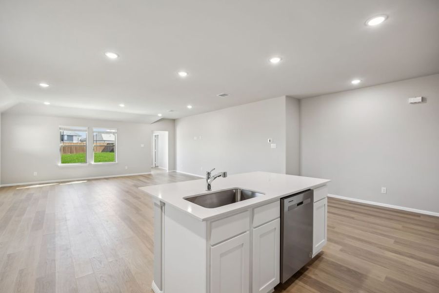 Kitchen in the Sabrina home plan by Trophy Signature Homes – REPRESENTATIVE PHOTO