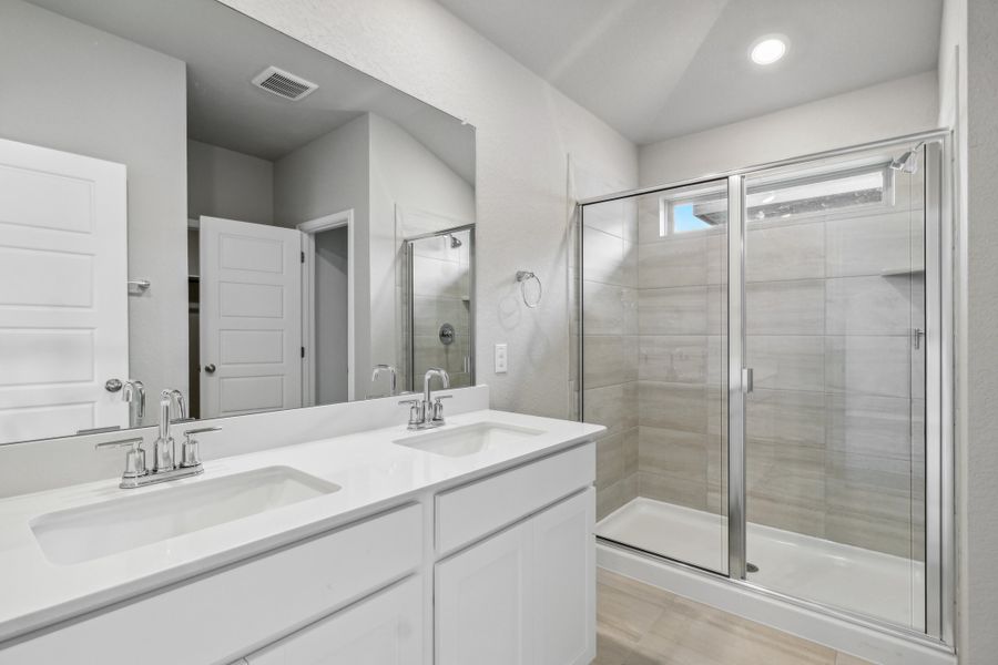 Primary suite bathroom in the Allen floorplan at a Meritage Homes community. Primary suite bathroom in the Allen floorplan at a Meritage Homes community.
