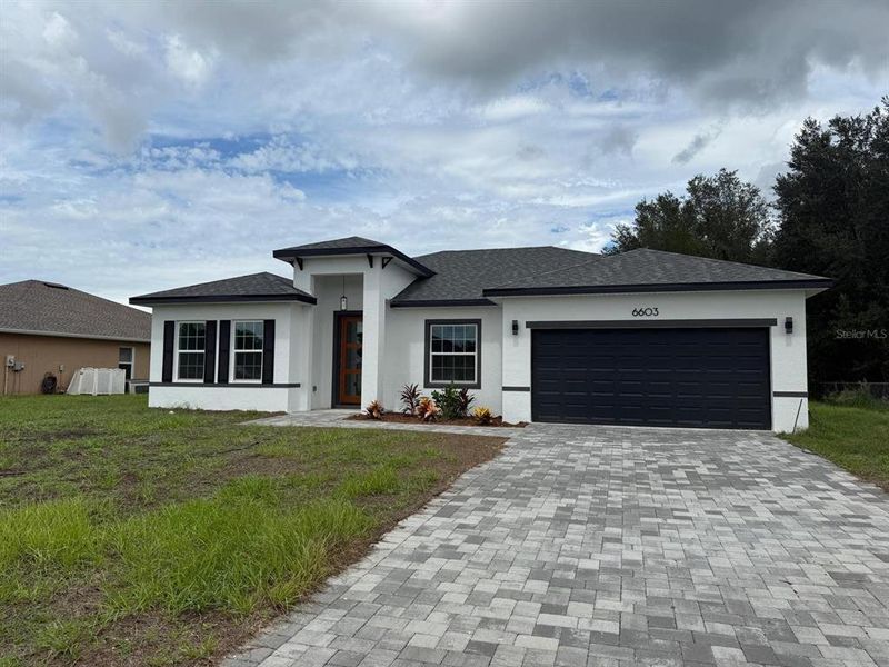 Front exterior of a new home in , Ocala, FL, highlighting curb appeal (Image 2). Front exterior of a new home in , Ocala, FL, highlighting curb appeal (Image 2).