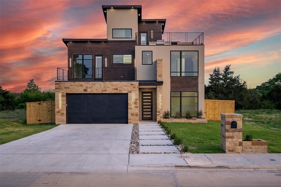 The property features a modern exterior with varied textures, including stone cladding, wood paneling, and smooth stucco finishes The property features a modern exterior with varied textures, including stone cladding, wood paneling, and smooth stucco finishes