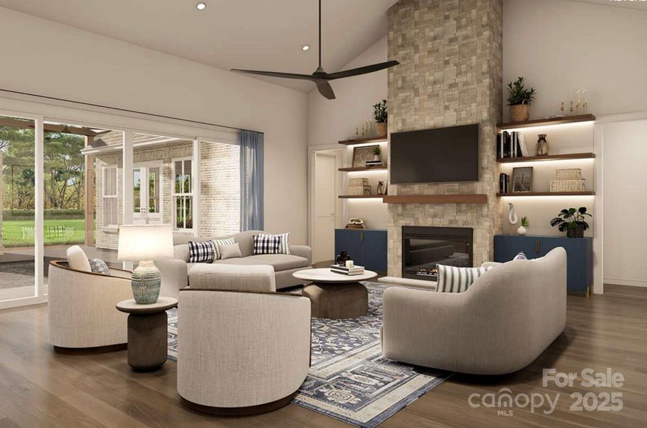 This inviting living room blends modern comfort with timeless elegance. A floor-to-ceiling stone fireplace anchors the space, flanked by built-in shelves with accent lighting and navy cabinetry for a pop of color. This inviting living room blends modern comfort with timeless elegance. A floor-to-ceiling stone fireplace anchors the space, flanked by built-in shelves with accent lighting and navy cabinetry for a pop of color.