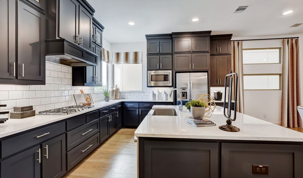 Ample cabinet space in gourmet kitchen