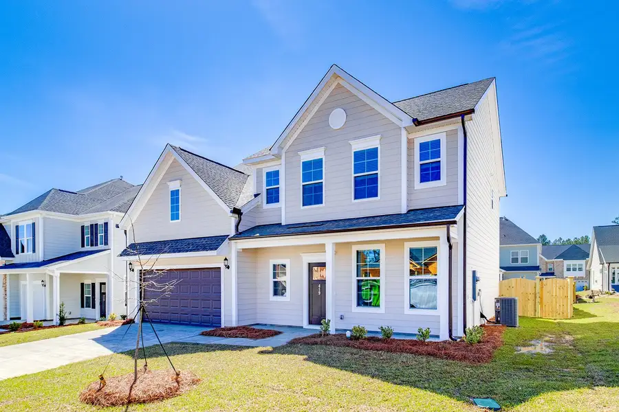 Front exterior of a new home in Pebble Branch, Chapin, SC, highlighting curb appeal (Image 2). Front exterior of a new home in Pebble Branch, Chapin, SC, highlighting curb appeal (Image 2).