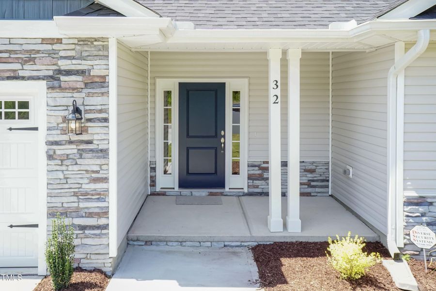 Exterior details and patio area of a home in Hadley Acres, La Grange (Image 32).