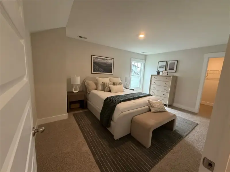 Plush wall-to-wall carpeting and a walk-in closet