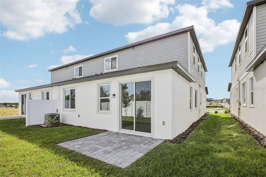 Exterior details and patio area of a home in Cyrene at Minneola - Villas, Minneola (Image 24).