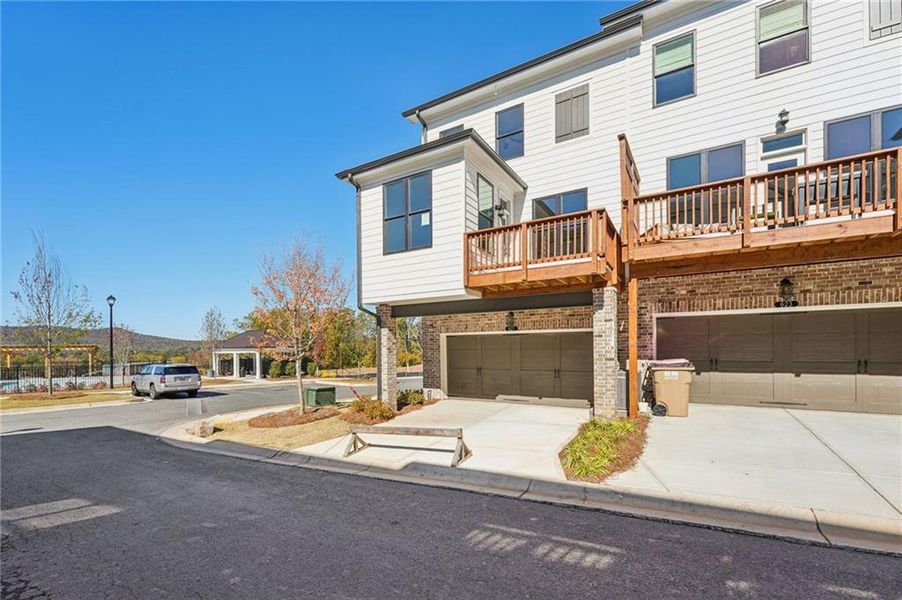 Exterior details and patio area of a home in Palisades Townhomes, Cumming (Image 26).
