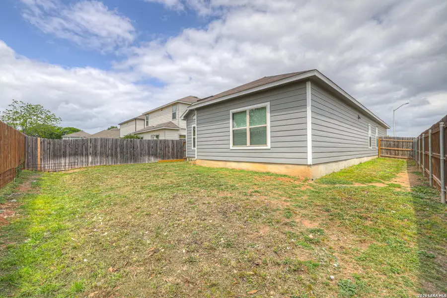 Exterior details and patio area of a home in Meadows of Martindale, Seguin (Image 18).