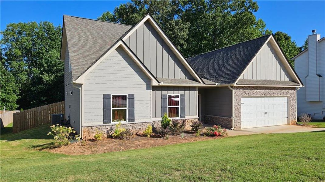 Front exterior of a new home in , Statham, GA, highlighting curb appeal (Image 20).