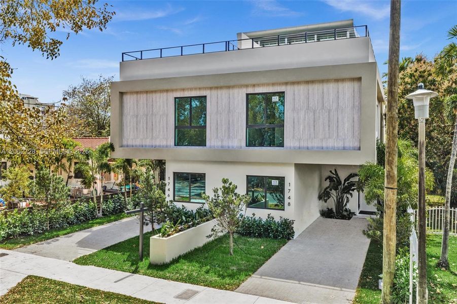 Front exterior of a new home in , Miami, FL, highlighting curb appeal (Image 1). Front exterior of a new home in , Miami, FL, highlighting curb appeal (Image 1).