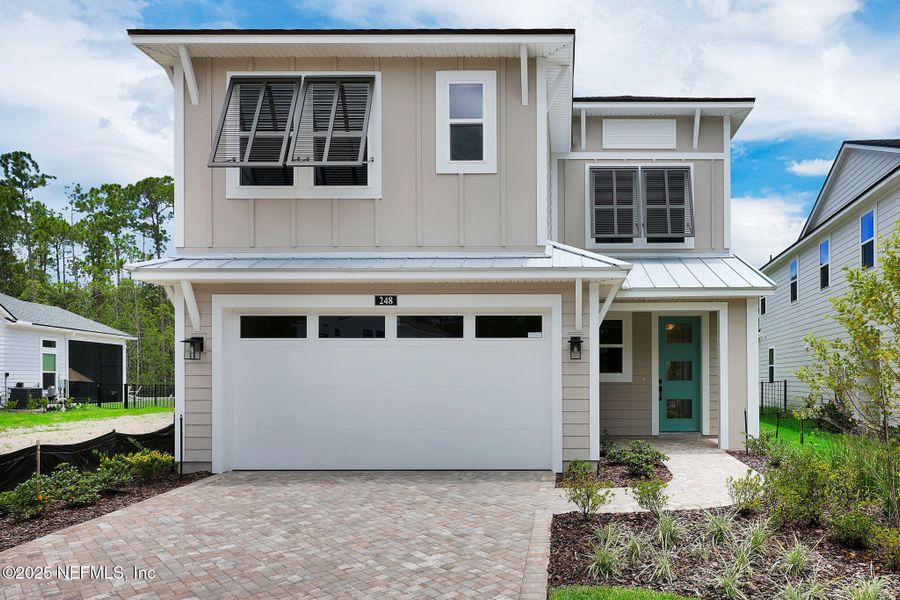 Front exterior of a new home in Reflections at Nocatee, Ponte Vedra, FL, highlighting curb appeal (Image 26).