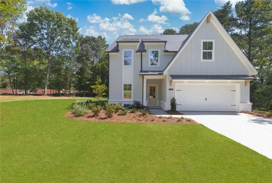 Front exterior of a new home in , Cumming, GA, highlighting curb appeal (Image 26).