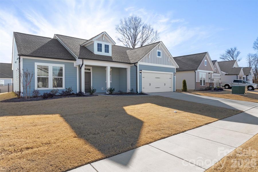 Front exterior of a new home in Encore at Harmony, Harrisburg, NC, highlighting curb appeal (Image 24).