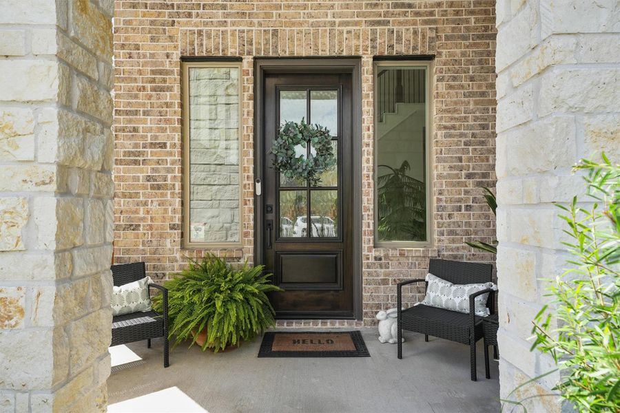 Vaulted covered entry/porch to welcome guests and family Vaulted covered entry/porch to welcome guests and family