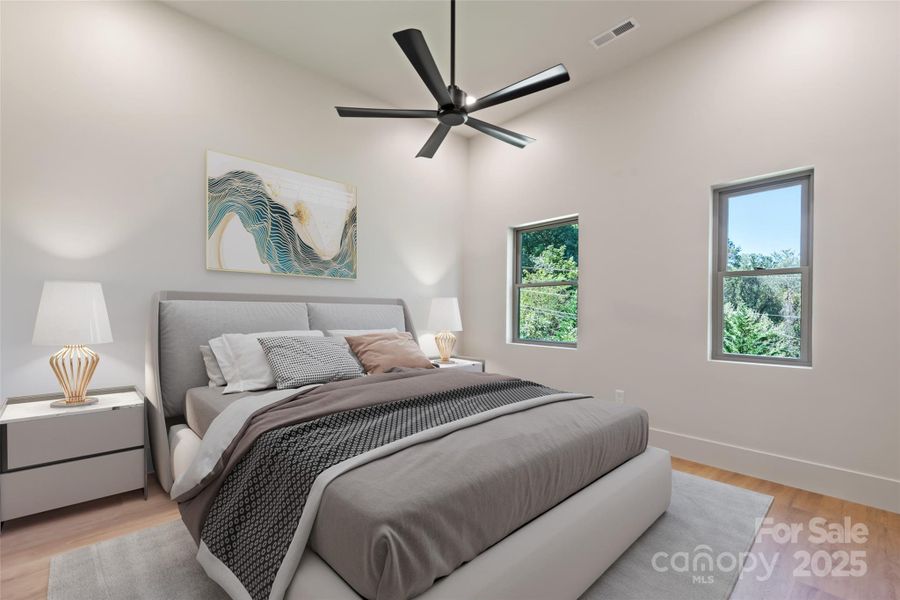 Second bedroom with 11' ceilings, plenty of closet space and Smoky Mountain views *Photo has been digitally staged for design purposes*