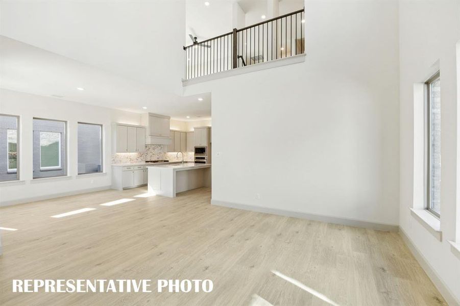 The game room overlooks your new family room creating dual entertainment levels.  REPRESENTATIVE PHOTO