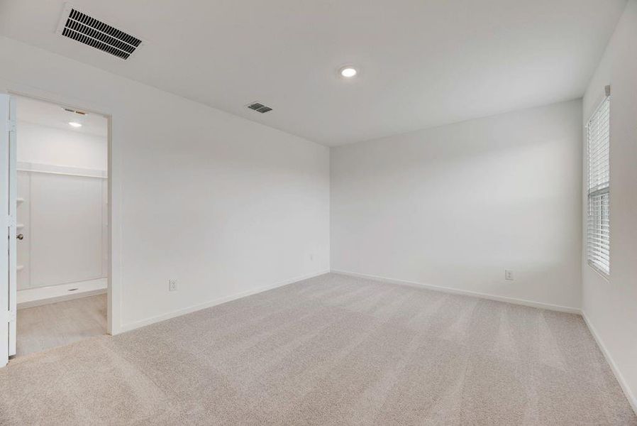 Unfurnished room featuring light colored carpet and recessed lighting