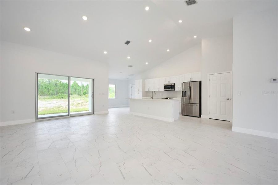 View of kitchen.  Doorway in back left of picture leads into master bedroom suite.  Door to the right is closet pantry.