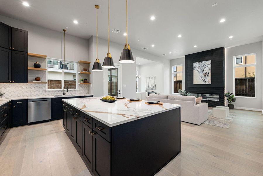 Sleek kitchen profile highlighting the designer backsplash and modern fixtures Sleek kitchen profile highlighting the designer backsplash and modern fixtures