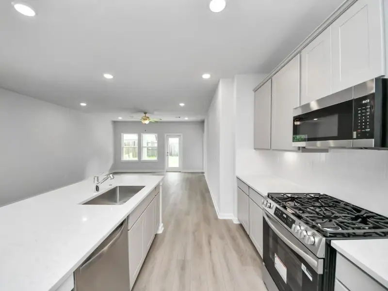 Furnished interior view inside a new home in Windmill Estates, Magnolia (Image 8).