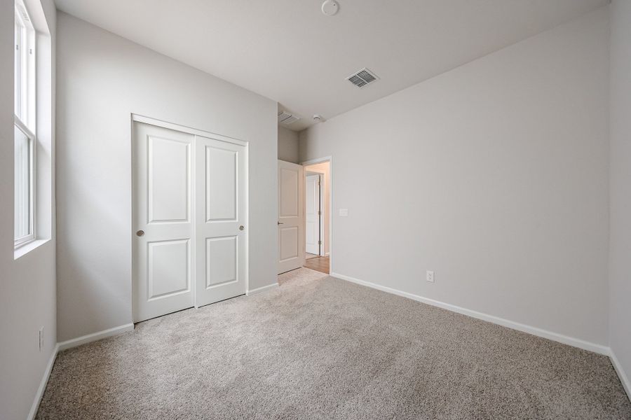 A hallway with white doors.