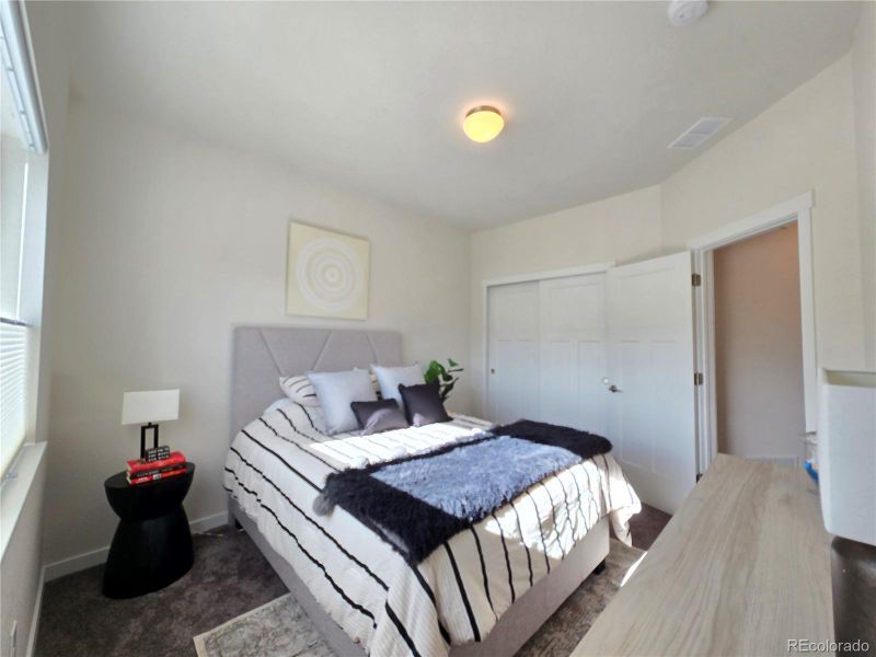 Bedroom three has room for a queen bed, nightstands, and dresser.