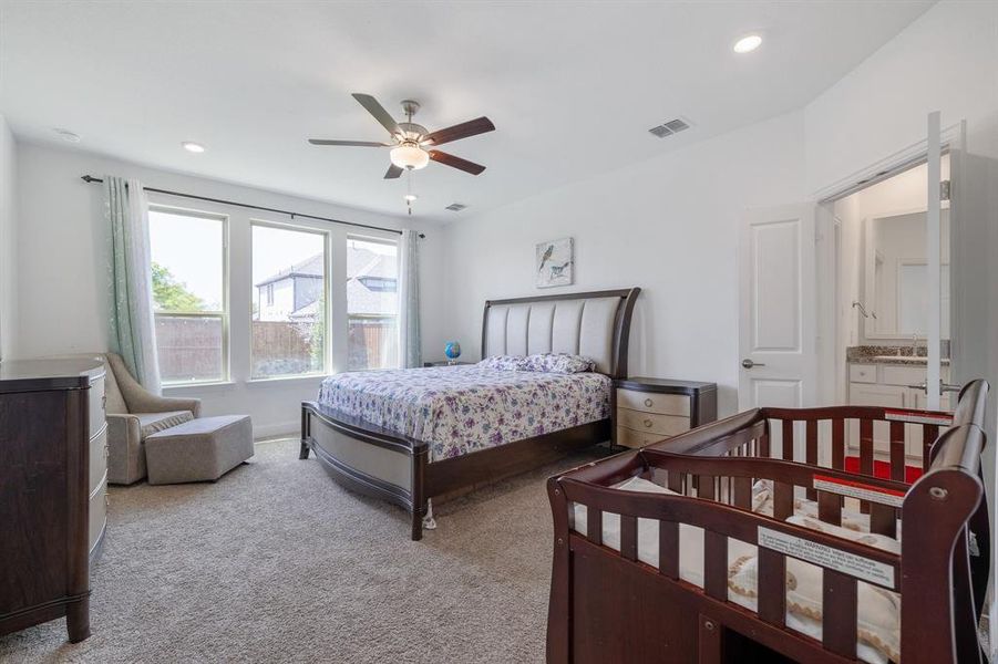 Carpeted bedroom featuring recessed lighting, visible vents, and ceiling fan