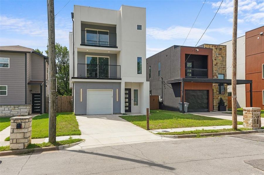 Front exterior of a new home in , Dallas, TX, highlighting curb appeal (Image 25).