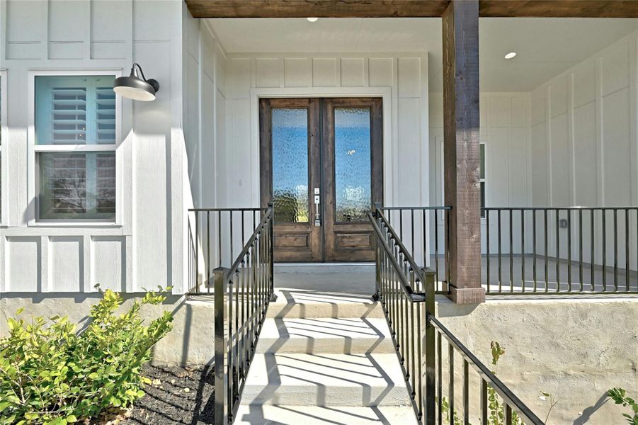 This welcoming front porch offers plenty of space to create a beautiful outdoor living area.