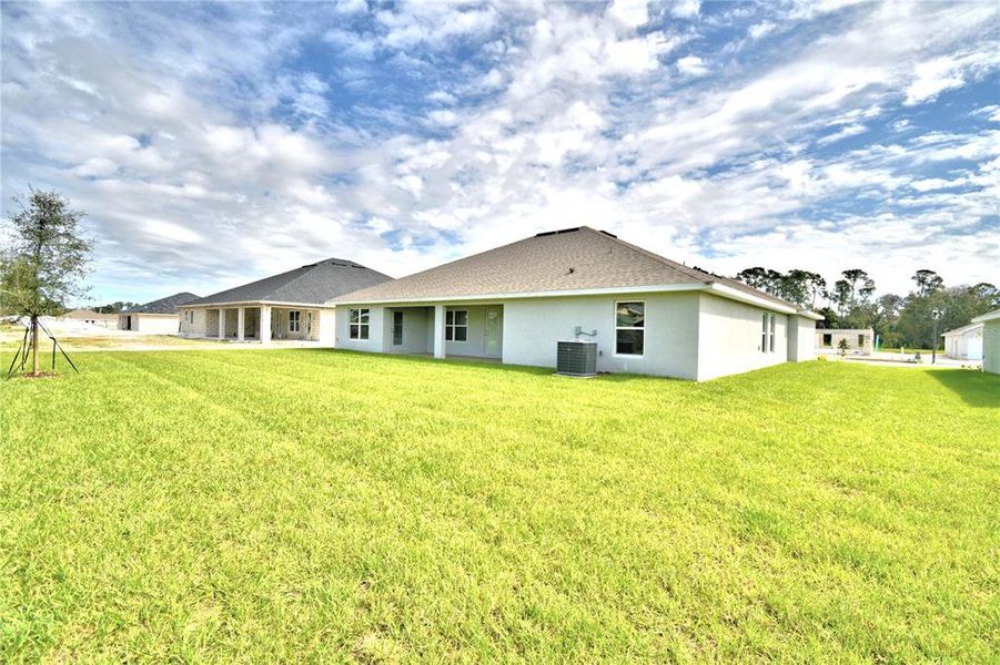 Exterior details and patio area of a home in Cadence Crossing, Auburndale (Image 32).