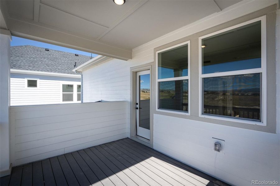 Exterior details and patio area of a home in Revel Crossing at Wolf Ranch - The Panorama Collection, Colorado Springs (Image 24).