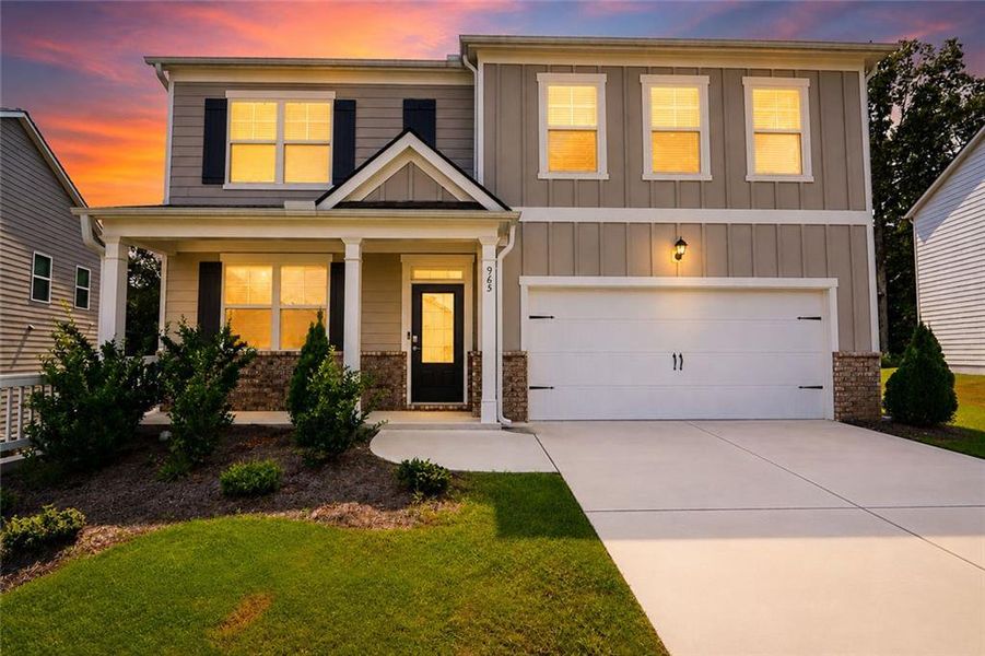 Front exterior of a new home in Oakhurst Glen, Fairburn, GA, highlighting curb appeal (Image 1). Front exterior of a new home in Oakhurst Glen, Fairburn, GA, highlighting curb appeal (Image 1).