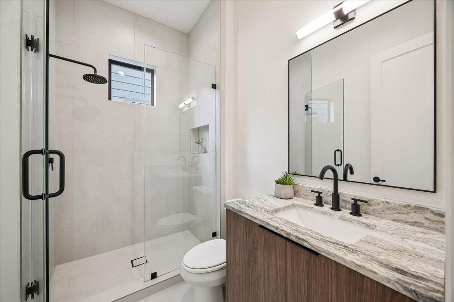 En-suite bath #5 - features a walk-in shower with frameless glass shower door. En-suite bath #5 - features a walk-in shower with frameless glass shower door.