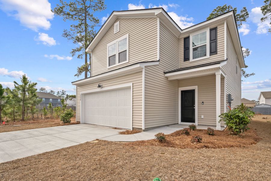Front exterior of a new home in Grand Arbor, Blythewood, SC, highlighting curb appeal (Image 20).