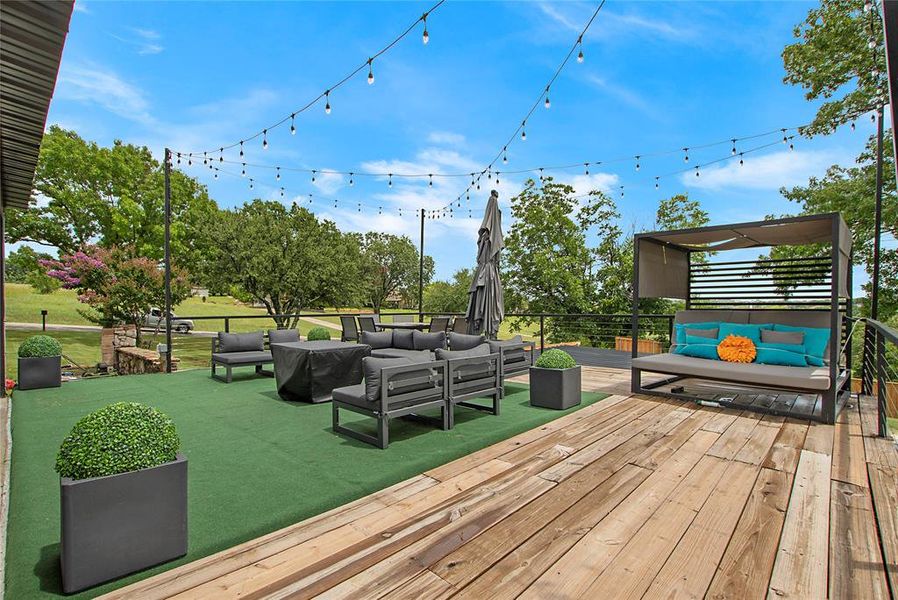 Wooden terrace featuring outdoor lounge area Wooden terrace featuring outdoor lounge area