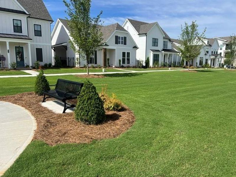 Front exterior of a new home in Promenade at Sawnee Village, Cumming, GA, highlighting curb appeal (Image 21).