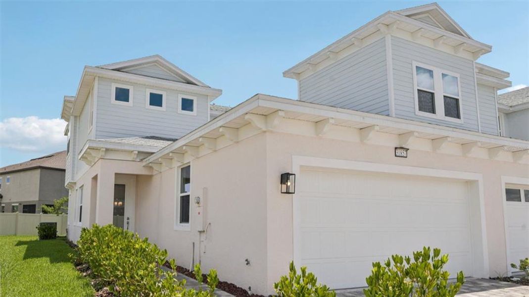 Front exterior of a new home in Lagoon Residences at Epperson, Wesley Chapel, FL, highlighting curb appeal (Image 1).