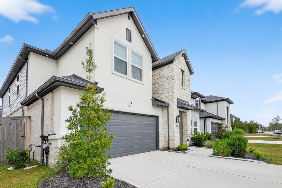 Front exterior of a new home in Avalon at Cypress, Cypress, TX, highlighting curb appeal (Image 23).