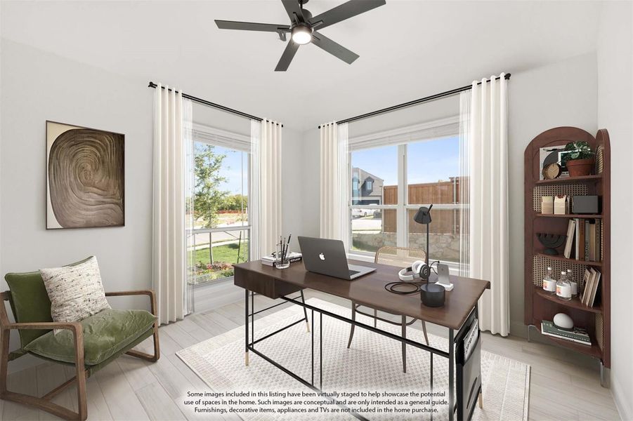 Home office with wood desk, ceiling fan, two large windows, and light hardwood floors Home office with wood desk, ceiling fan, two large windows, and light hardwood floors