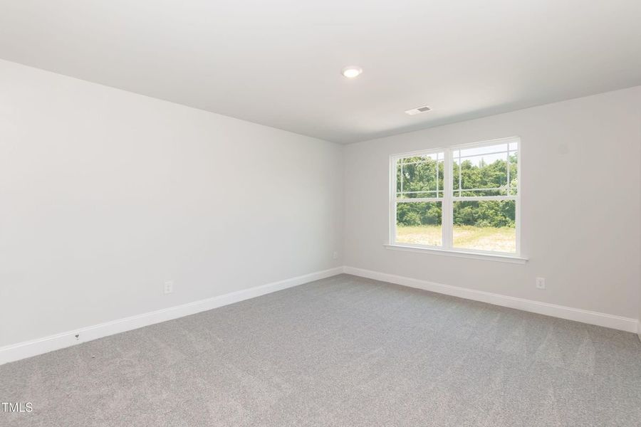 Representative unfurnished interior of a home built from the 2709 by Adams Homes in The Grove at Ballard, Jacksonville (Image 34).