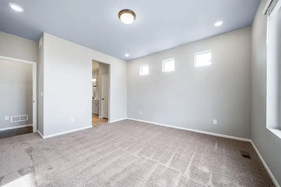 Spacious, unfurnished interior of a new home in The Reserve at Green Valley Ranch, Aurora (Image 19).