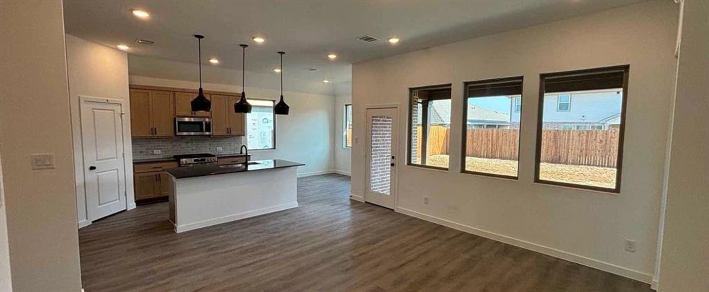 Open Kitchen-Living-Dining Room Construction Progress featuring the Foundry Collection