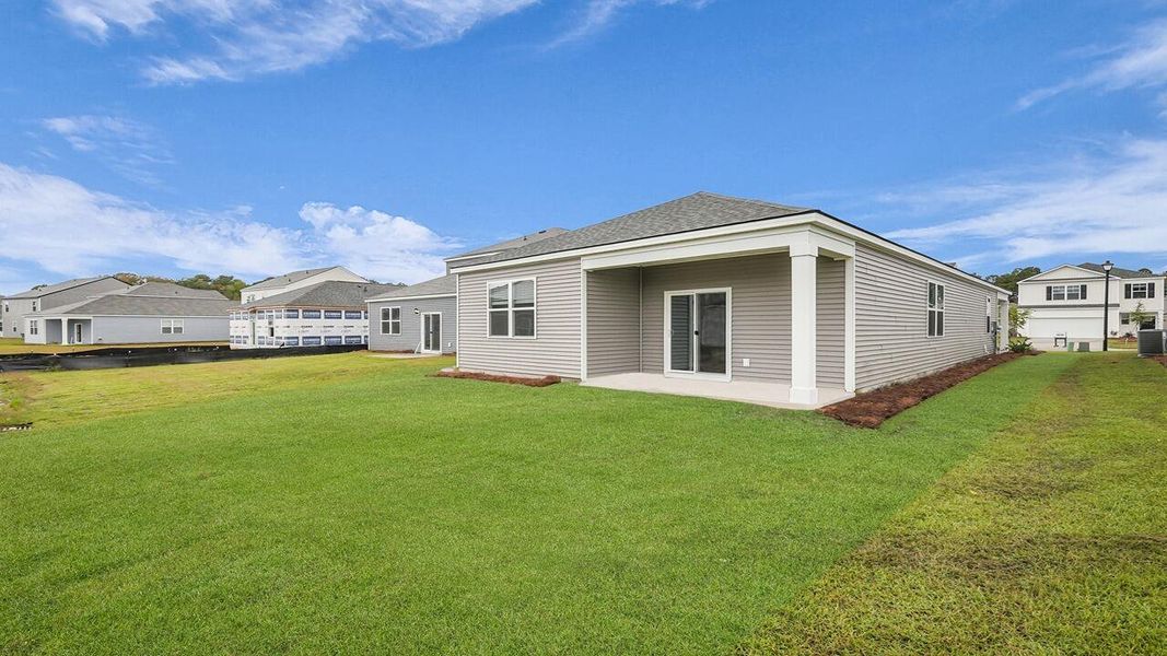 Exterior details and patio area of a home in Pine Hills at Cane Bay, Summerville (Image 3).