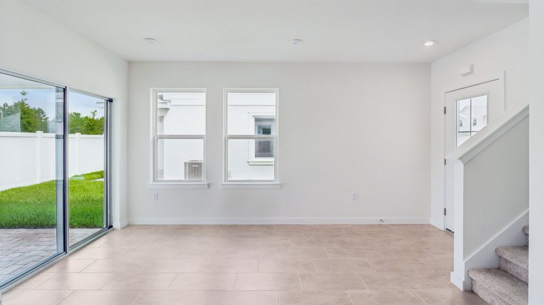 Living Room in the Monterey End Townhome by DRB Homes - Cyrene at Harmony in St Cloud FL