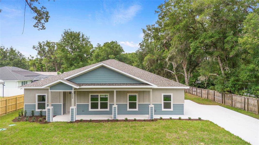 Front exterior of a new home in , Lake Helen, FL, highlighting curb appeal (Image 1).