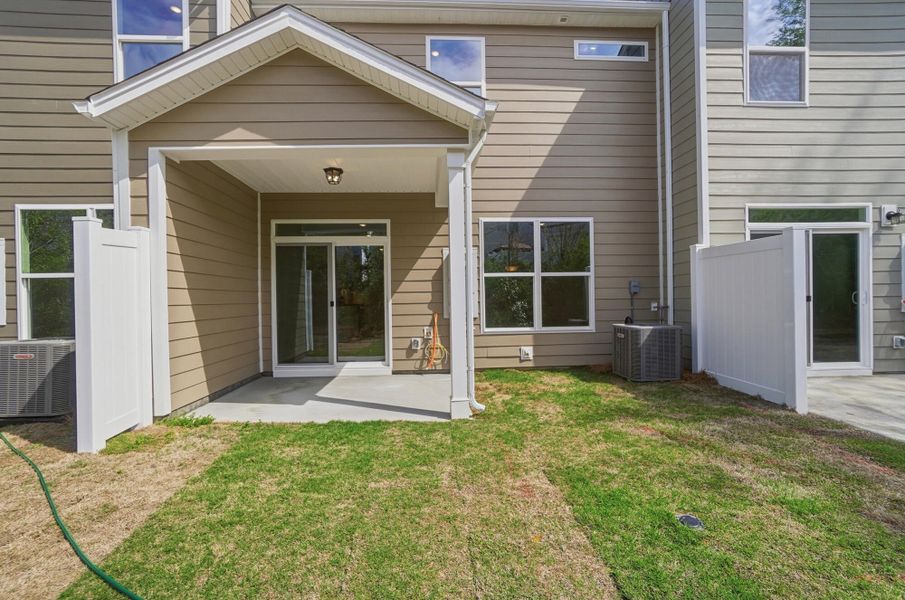 Exterior details and patio area of a home in Harrisburg Village Townhomes, Harrisburg (Image 29).