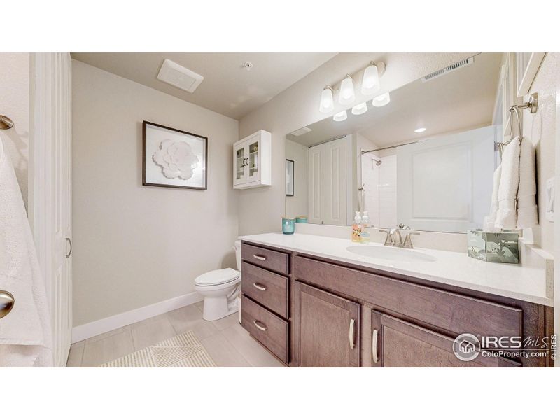 Hall bathroom with full tub