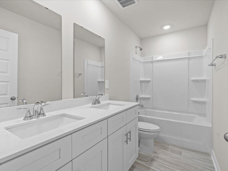 Furnished interior view inside a new home in The Farm at Wells Creek - Signature Collection, Gray Court (Image 6).